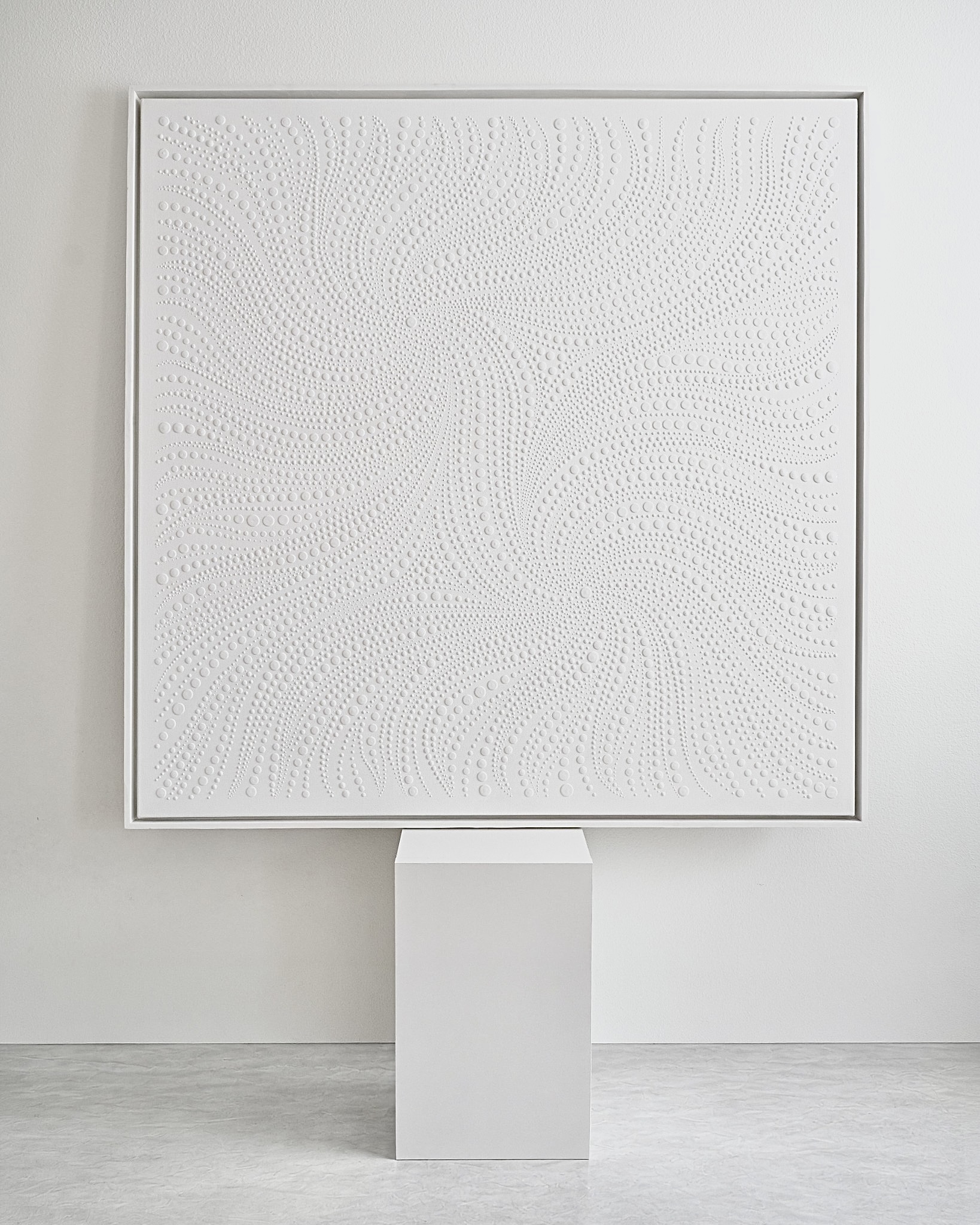 Original white textured canvas artwork displayed in a minimalist gallery setting