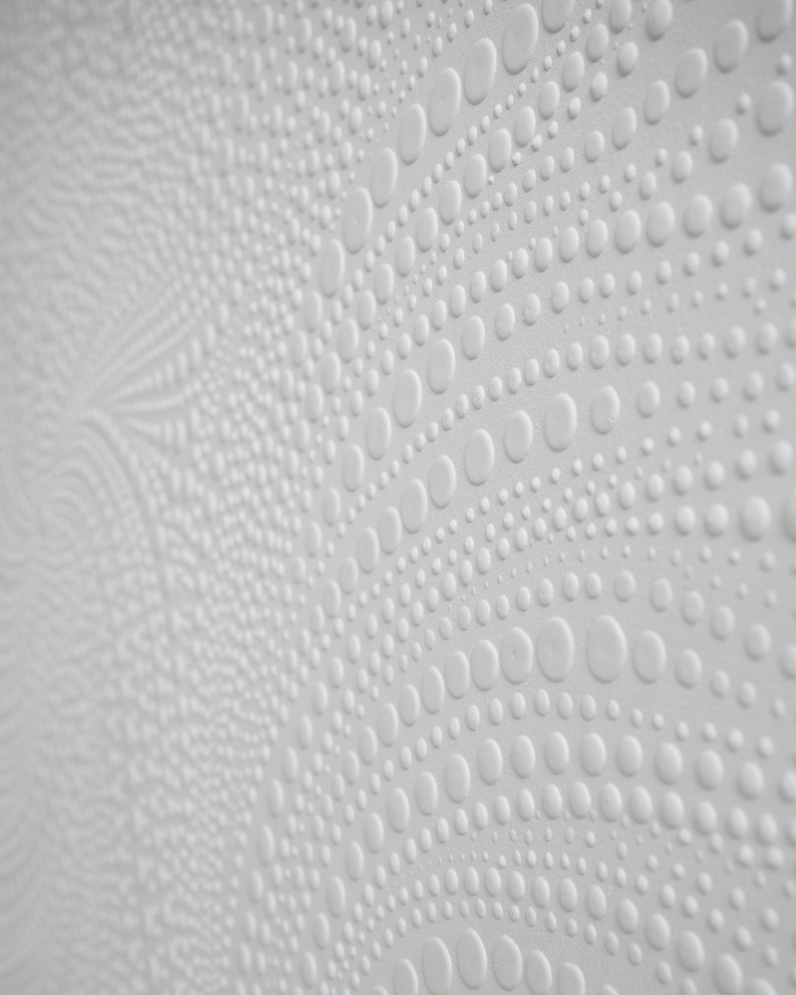 Rhythm of Peace: angled macro view of the sculpted white surface
